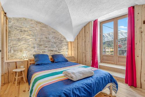 Ένα ή περισσότερα κρεβάτια σε δωμάτιο στο Gite du lézard