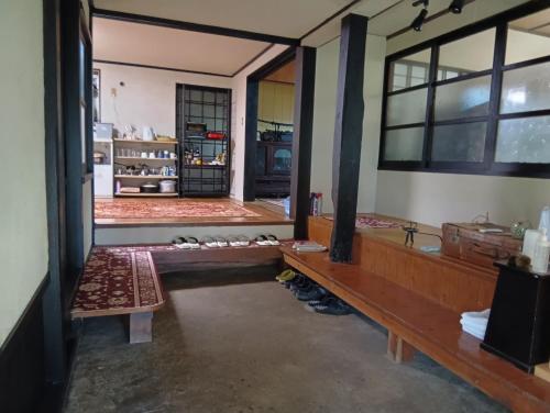 Ένα ή περισσότερα κρεβάτια σε δωμάτιο στο 横城ゲストハウス 自然豊かなプライベート空間 古民家一棟貸しの宿