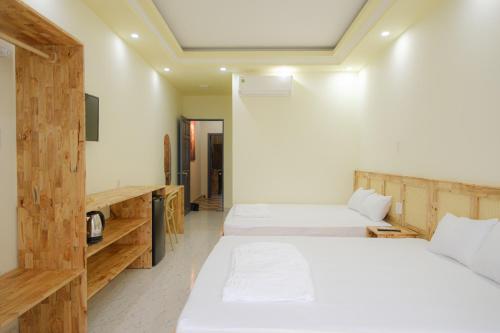 Ein Bett oder Betten in einem Zimmer der Unterkunft De Rivé Homestay 2 - Bến Ninh Kiều