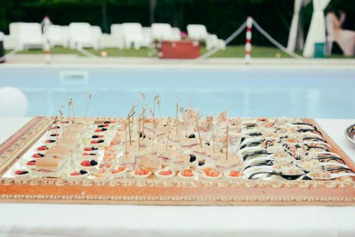 a cake sitting on top of a table at Hotel Garden Experience in Città di Castello