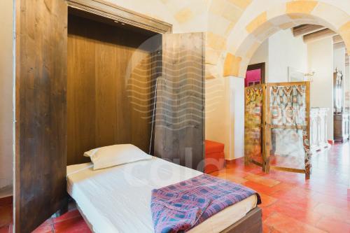 En eller flere senge i et værelse på Villa Alièe piscina privata - By Cala Salento