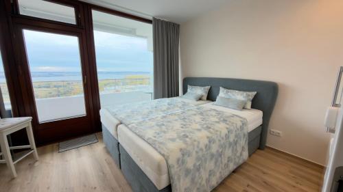 En eller flere senge i et værelse på Passatblick