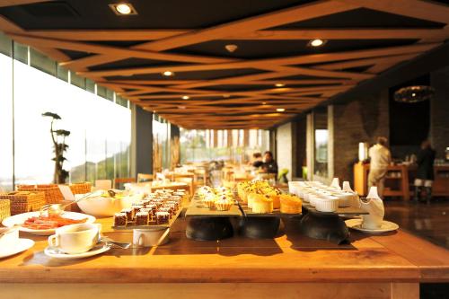 a buffet line with food on a table at Enjoy Chiloé in Castro