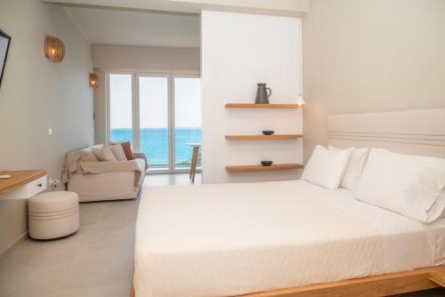 Ένα ή περισσότερα κρεβάτια σε δωμάτιο στο Elia Suites