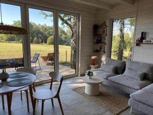 a living room with a couch and a table at Skryta Chata Ojców in Smardzowice