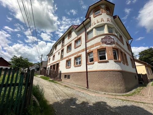 a large brick building on the side of a street at Вілла Токай in Rakhiv