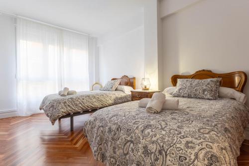 Postel nebo postele na pokoji v ubytování casa cervantes