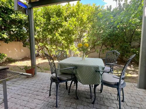 a table and chairs sitting on a patio at Stay on Main Garden Apartment in Paarl