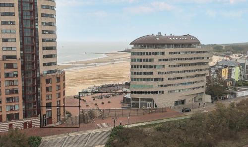 a view of a city with a beach and buildings at Suites Boulevard 17 in Vlissingen
