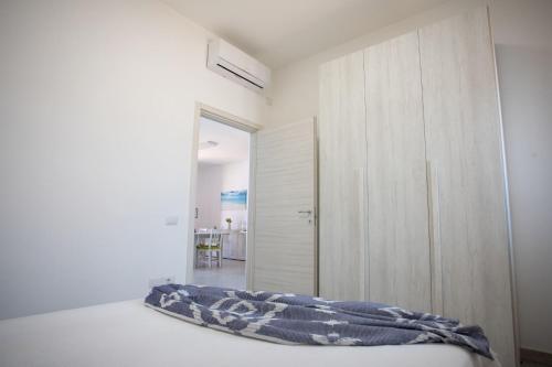 Ένα ή περισσότερα κρεβάτια σε δωμάτιο στο Villa LUCE DEL SUD Punta Prosciutto