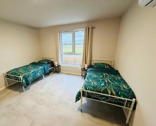 Postel nebo postele na pokoji v ubytování Maison MUGUET 4 SPA-PARKING-COLMAR