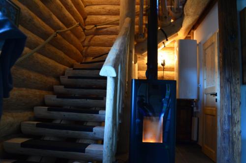 a staircase in a house with a wooden ceiling at Ferner Alm in Thomatal
