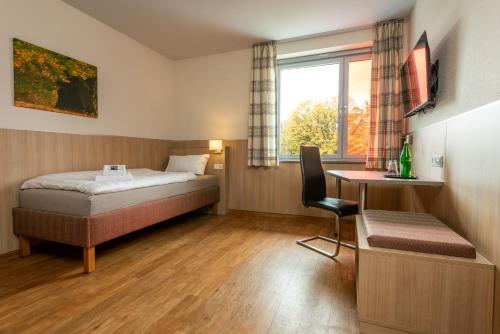 Postel nebo postele na pokoji v ubytování Gästehaus DEULA