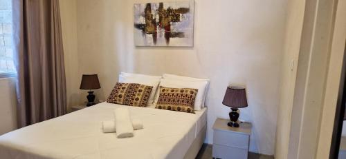 Postel nebo postele na pokoji v ubytování Comfort Inn Guest House