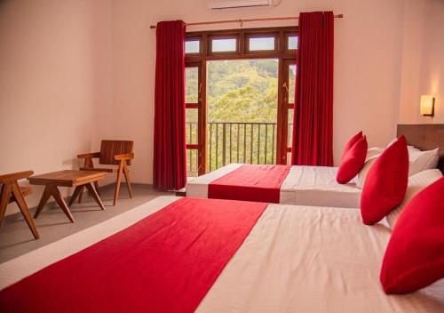 a hotel room with two beds and a window at Scenic View - Ella in Ella
