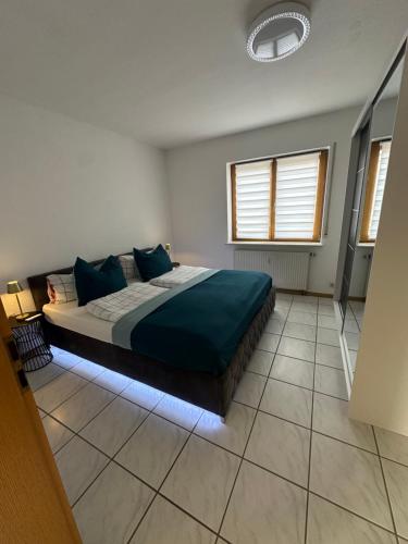 Postel nebo postele na pokoji v ubytování Ferienwohnung in Rheinfelden, Grenznähe und Blick auf die Schweiz