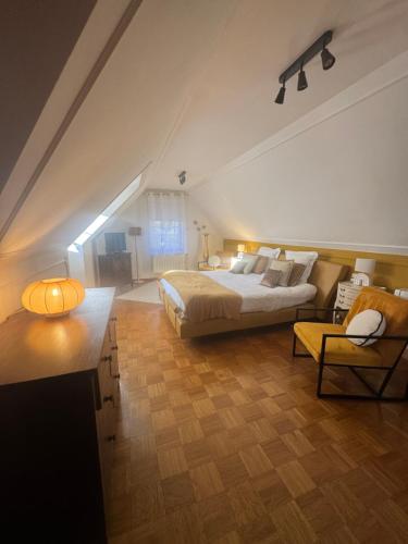 Postel nebo postele na pokoji v ubytování Le Temps d'un Rêve