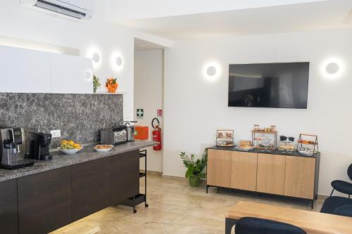 Η κουζίνα ή μικρή κουζίνα στο Talìa Rooms and Gallery