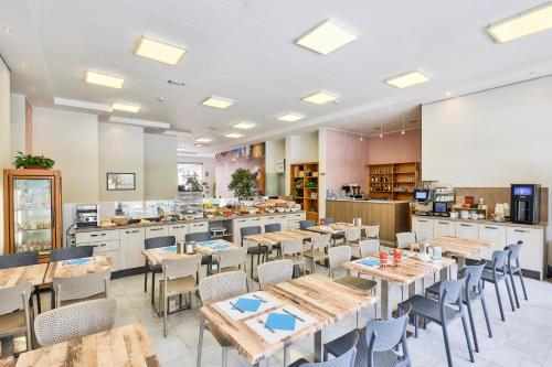 Um restaurante ou outro lugar para comer em Hotel Tre Ville