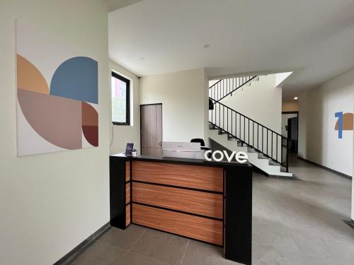 an office with a desk in the middle of a hallway at Cove Legacy in Jakarta