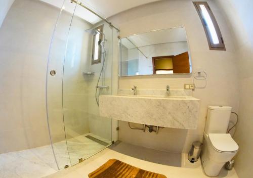 a bathroom with a sink and a shower at Villa with Private Pool in Marrakech - Dar Mazar in Oubadine