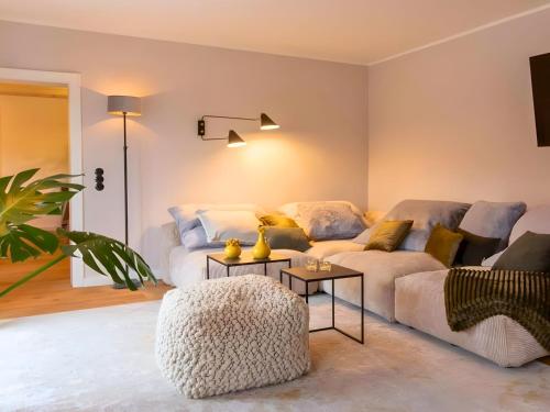 a living room with a couch and a table at N3 Quartier in Kall