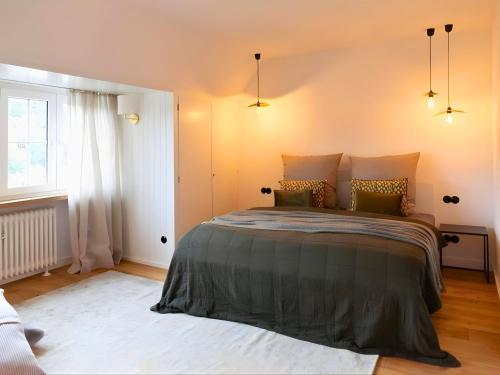 a bedroom with a large bed and a window at N3 Quartier in Kall
