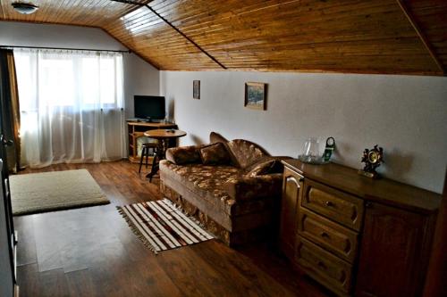 a living room with a couch and a table at Hovanka in Yaremche