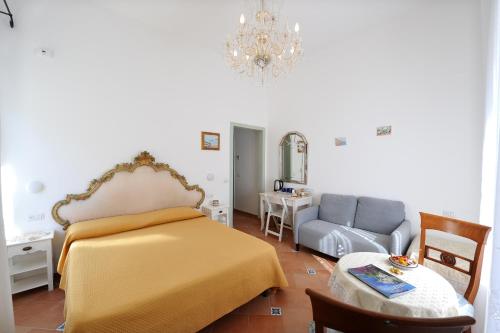 Ένα ή περισσότερα κρεβάτια σε δωμάτιο στο La Cascata