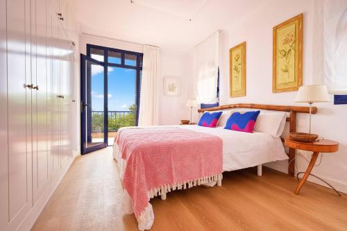 En eller flere senge i et værelse på Villa Flamboyán Meloneras