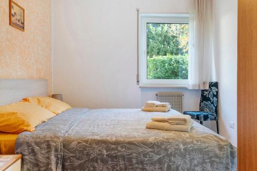 Ένα ή περισσότερα κρεβάτια σε δωμάτιο στο Appartamento Verde-Blu