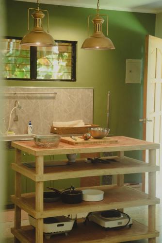 a kitchen with a table with some bowls on it at Filo La Union in San Juan