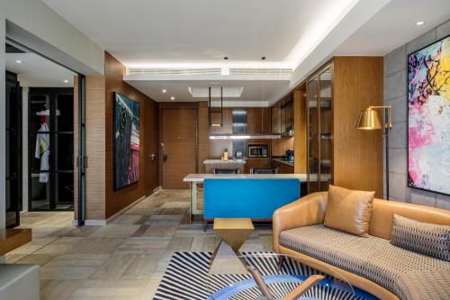 a living room with a couch and a table at Andaz Family Suites by Hyatt- Palm Jumeirah in Dubai