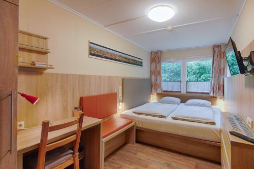 Ένα ή περισσότερα κρεβάτια σε δωμάτιο στο Schwedenhaus Wismar