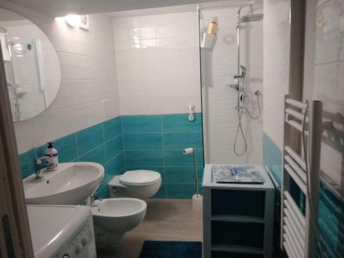 a bathroom with a sink and a toilet and a shower at La Perla del Borgo in Vieste
