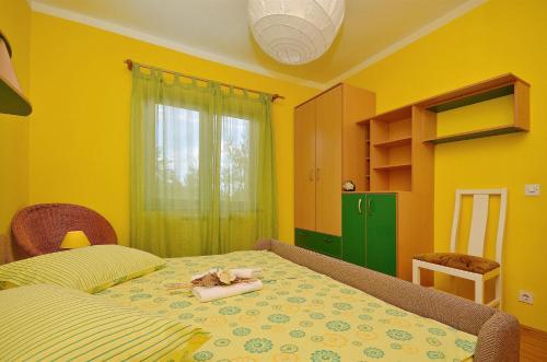 En eller flere senge i et værelse på Apartment Tonkica