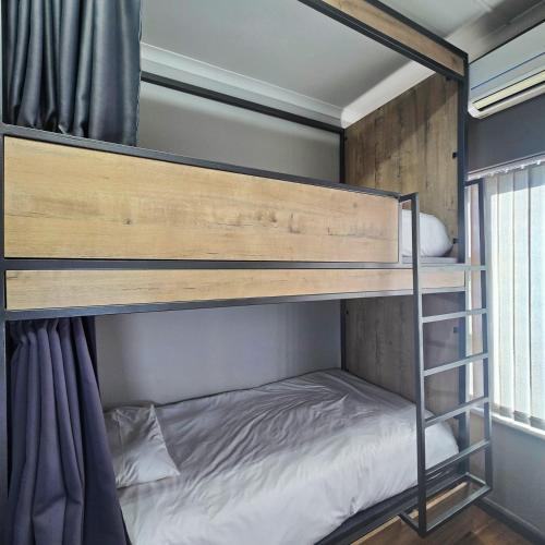 a bunk bed in a room at Beds Inn George in George