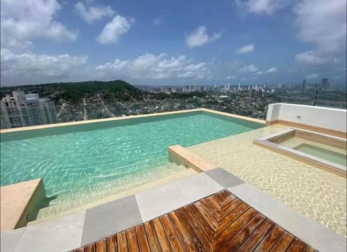 a large swimming pool on top of a building at Tu apartamento en la playa piso 10 in Cartagena de Indias