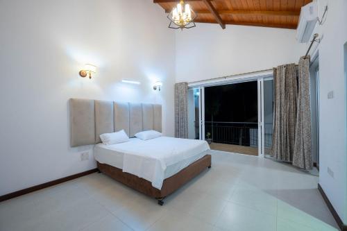 Ένα ή περισσότερα κρεβάτια σε δωμάτιο στο Blossom Villa Thalawathugoda