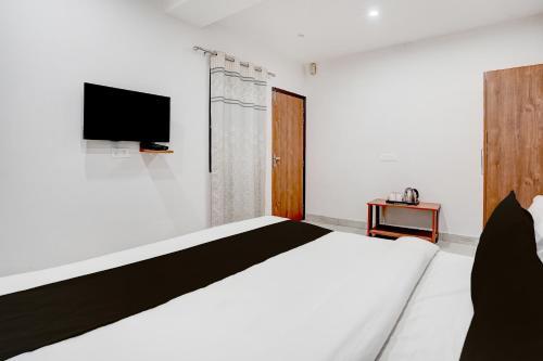 Ένα ή περισσότερα κρεβάτια σε δωμάτιο στο Townhouse Sarai Rohilla Railway Station Formerly Fortune Residency