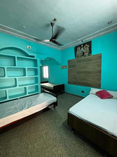 Ένα ή περισσότερα κρεβάτια σε δωμάτιο στο NPS Homestay