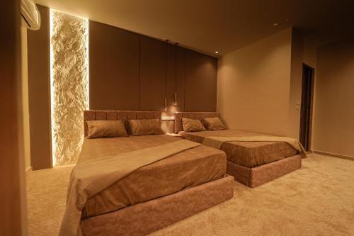 Ένα ή περισσότερα κρεβάτια σε δωμάτιο στο Sydney Downtown Cairo Hotel