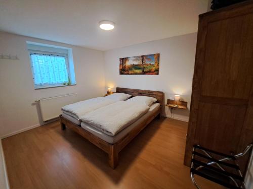 Postel nebo postele na pokoji v ubytování Ferien im Bergischen