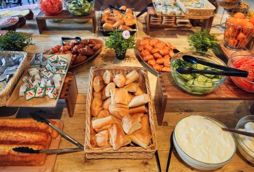 a table topped with lots of different types of food at St Christopher's Inn Paris - Gare du Nord in Paris
