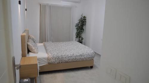 Ένα ή περισσότερα κρεβάτια σε δωμάτιο στο Aqua palms