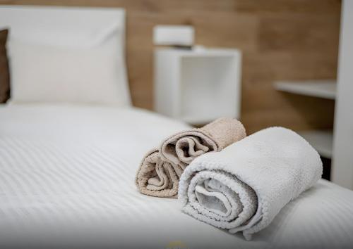 Ένα ή περισσότερα κρεβάτια σε δωμάτιο στο Platinum - Il Centro Luxury Suites