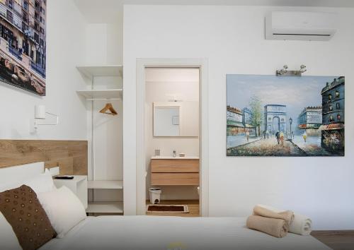 Ένα ή περισσότερα κρεβάτια σε δωμάτιο στο Platinum - Il Centro Luxury Suites