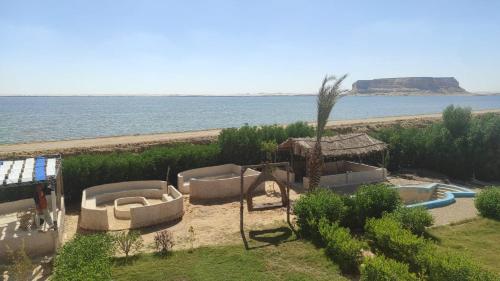 a resort with a swimming pool and a beach at Esewan siwa oasis in Siwa