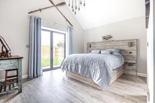 Voodi või voodid majutusasutuse Olive's Cottage toas