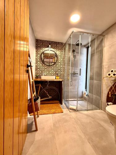 a bathroom with a shower and a sink at LARANJEIRA das LOIRAS in Óbidos